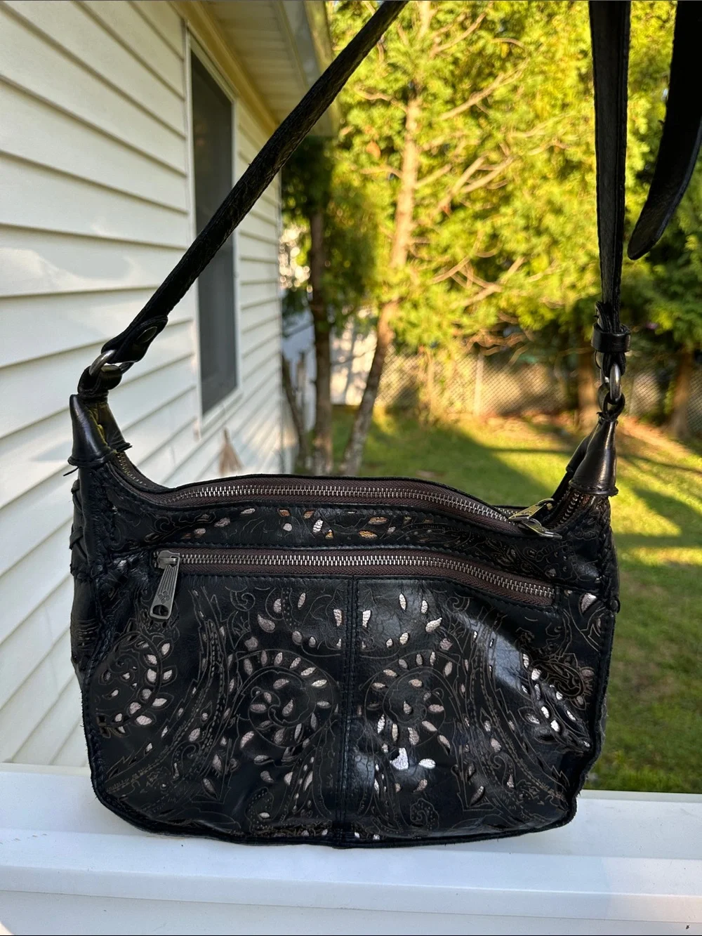 Patricia Nash Black Floral Cutout Crossbody with Tassel Accent